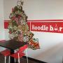 Sitting and wall painting area at The Noodle Bar Roeselare